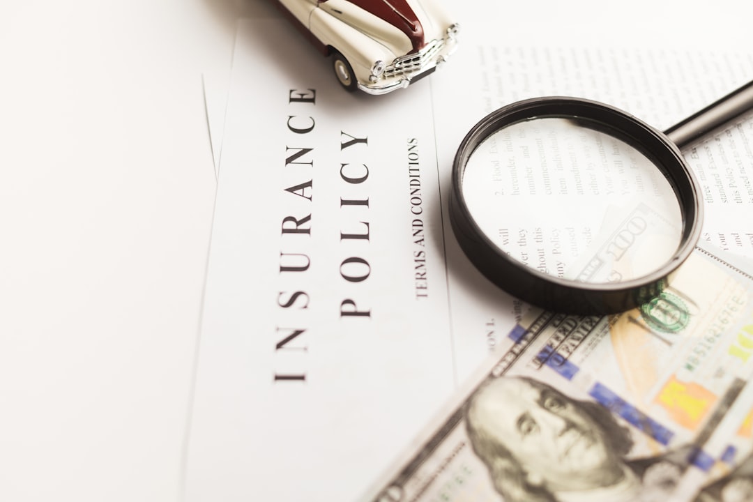 Insurance paperwork and pen