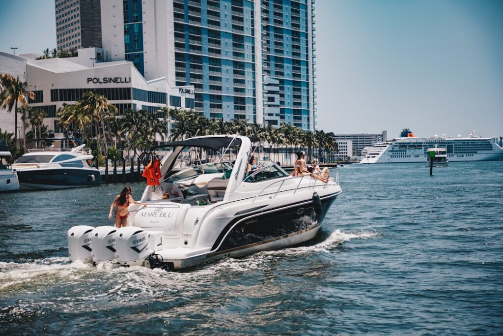 Florida boating license cost - speedboat cruising Florida waterway near Miami